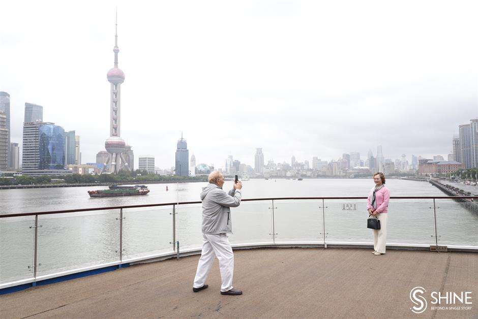 luxury cruise liner docks on north bund, with 300 international tourists